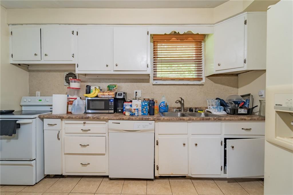 624 Frayne Street Pittsburgh, PA 15207 - Photo 13 of 21 a kitchen with white cabinets and sink