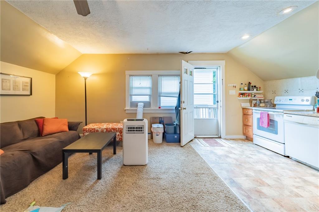 624 Frayne Street Pittsburgh, PA 15207 - Photo 17 of 21 a living room with furniture and a kitchen area