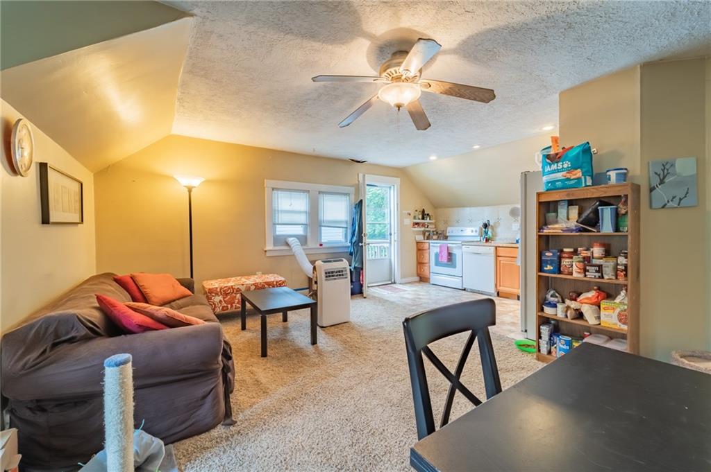 624 Frayne Street Pittsburgh, PA 15207 - Photo 20 of 21 a living room with furniture and a chandelier