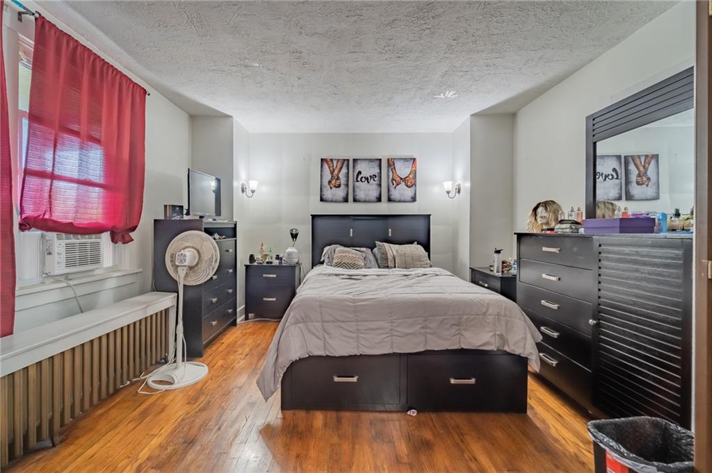 624 Frayne Street Pittsburgh, PA 15207 - Photo 8 of 21 a bedroom with a bed and a dresser