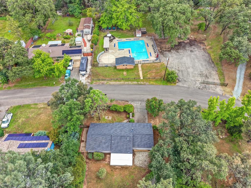 6689 Rhodes Avenue Placerville, CA 95667 - Photo 52 of 60 an aerial view of a house with a swimming pool a yard and a large tree
