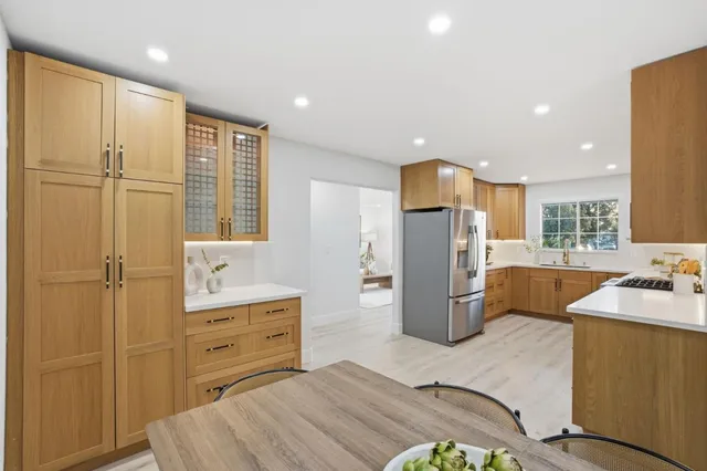 a kitchen with a table and chairs in it
