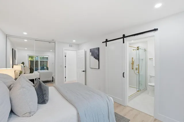 a bathroom with a toilet sink and shower