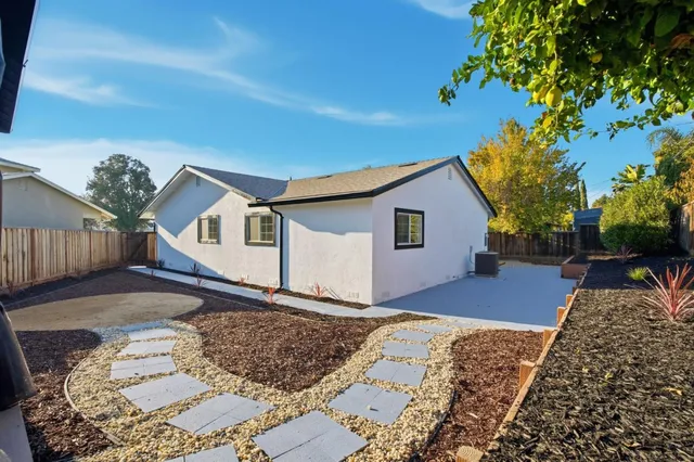 a view of deck with table and chairs under an umbrella with wooden floor