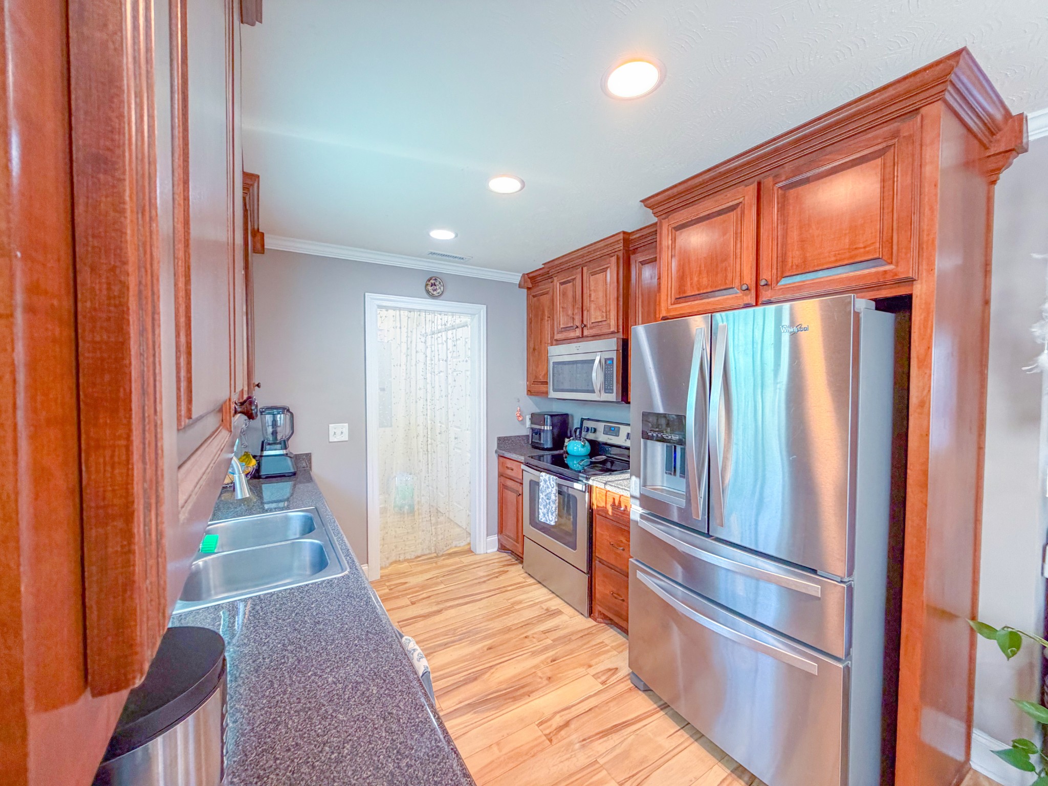 190 Johnson Road Pulaski, TN 38478 - Photo 21 of 41 a kitchen with stainless steel appliances granite countertop a refrigerator and a stove top oven