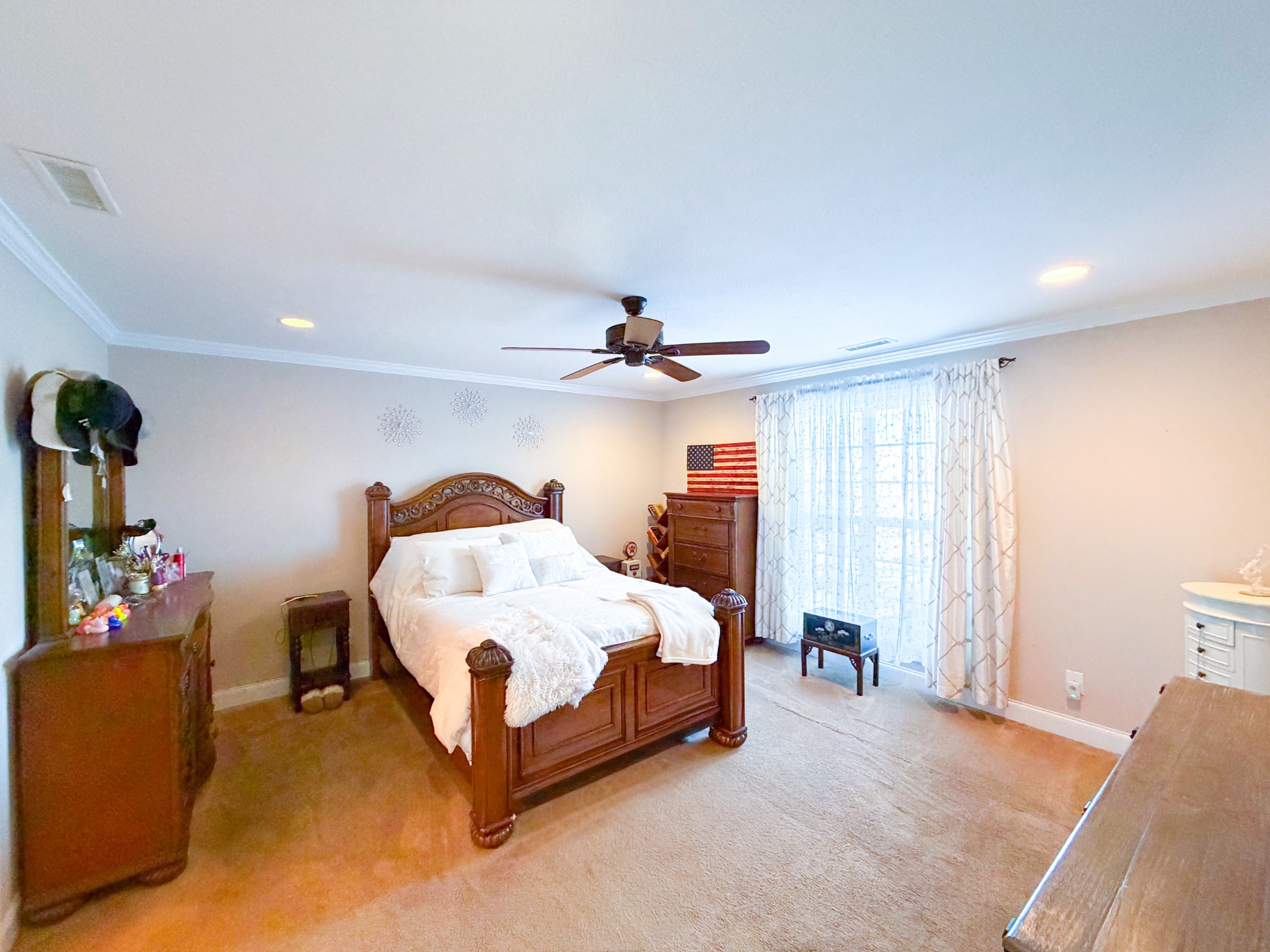 190 Johnson Road Pulaski, TN 38478 - Photo 25 of 41 a spacious bedroom with a bed and a chandelier