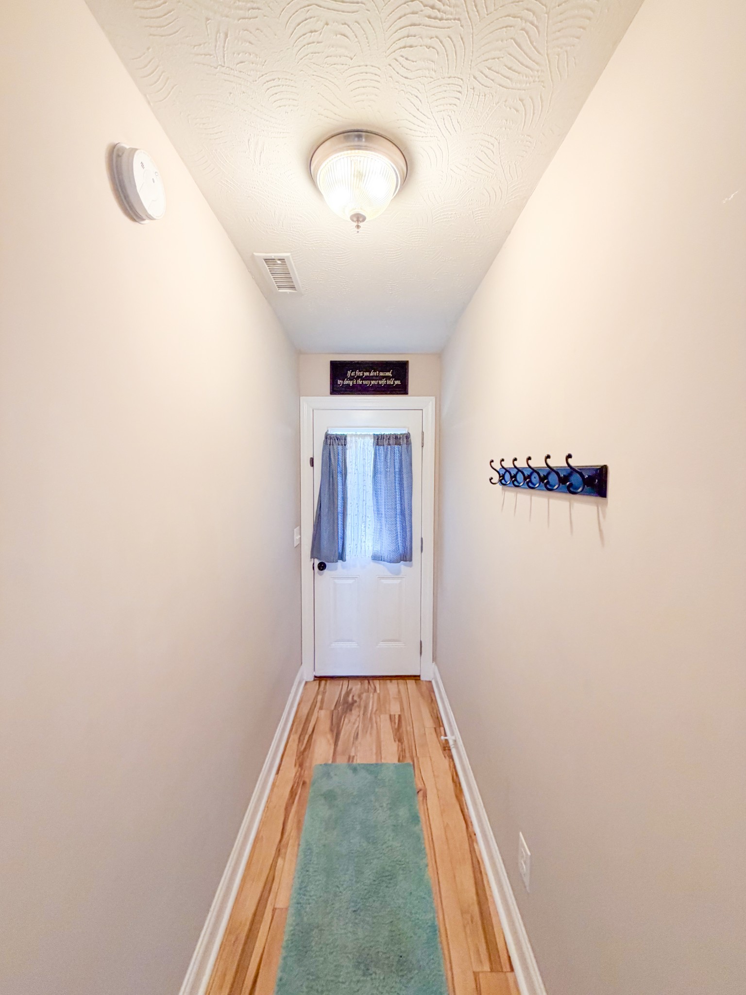 190 Johnson Road Pulaski, TN 38478 - Photo 35 of 41 a view of a hallway with wooden floor