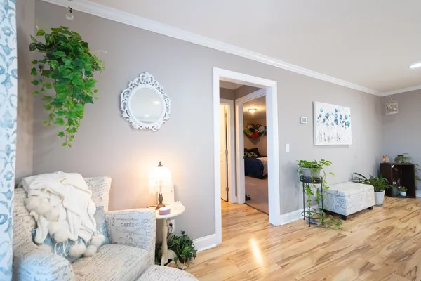 a living room with furniture and a lamp