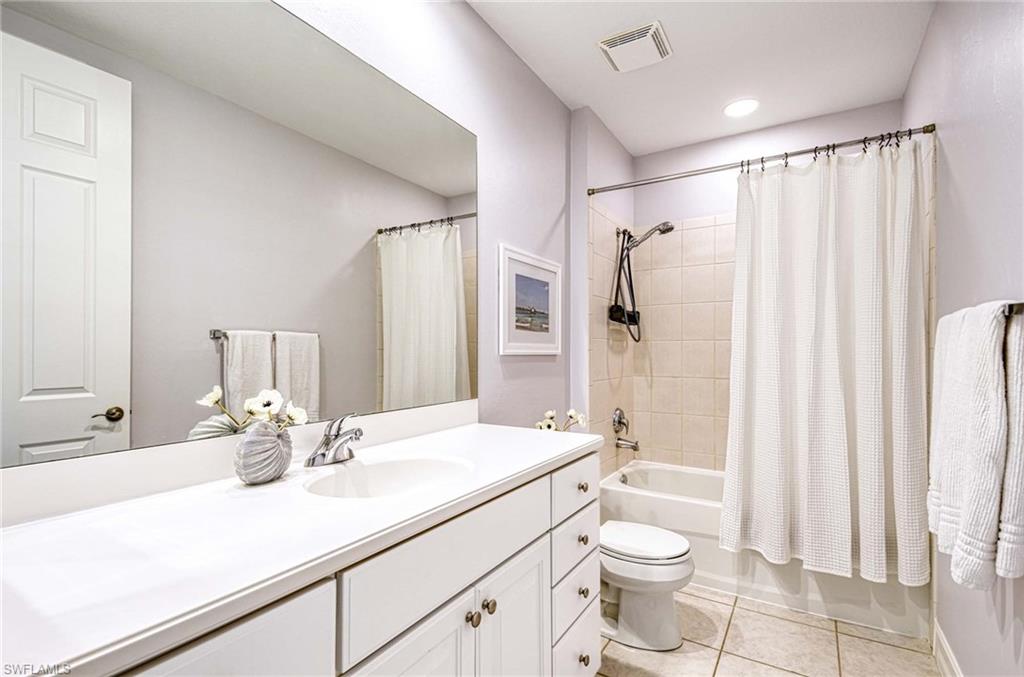 8649 Champions Point, Unit 1201 Naples, FL 34113 - Photo 16 of 23 Main bath with tub and shower