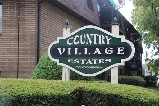 a sign broad on a brick wall