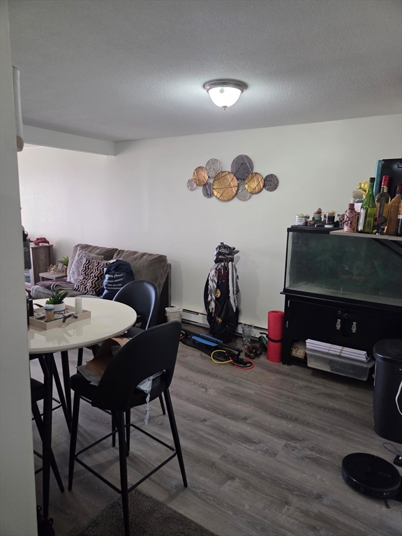 800 County Street, Unit 320 Taunton, MA 02780 - Photo 7 of 10 a dining room with furniture and wooden floor