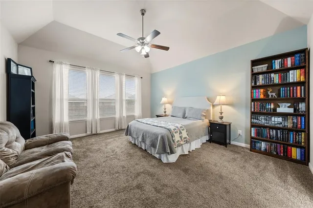 a view of a dining room with furniture and a window