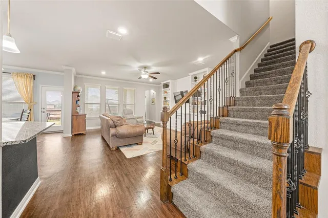 a view of entryway and hall with wooden floor