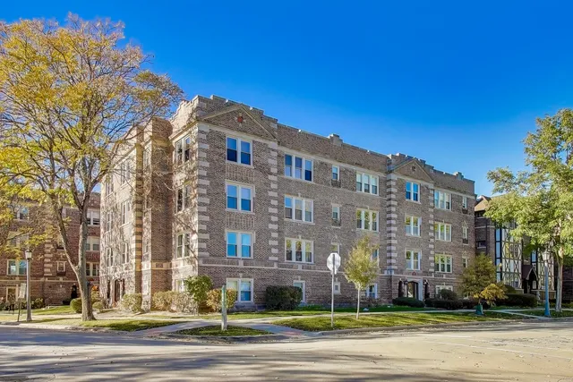 a view of a building with a yard