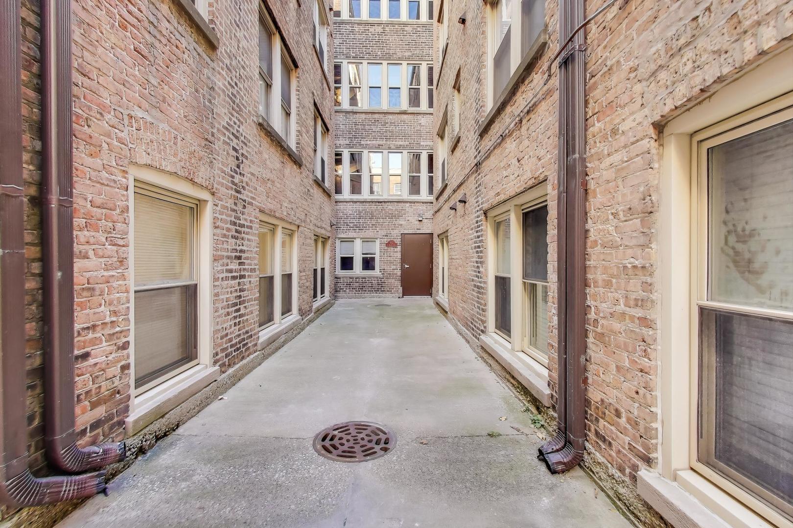46 6th Avenue, Unit GJ La Grange, IL 60525 - Photo 15 of 15 a view of a brick house with a large windows