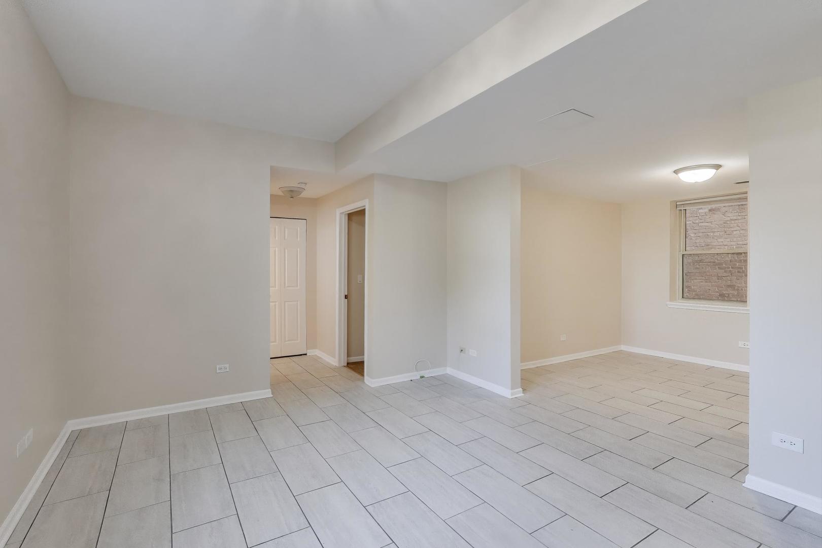 46 6th Avenue, Unit GJ La Grange, IL 60525 - Photo 3 of 15 an empty room with white walls