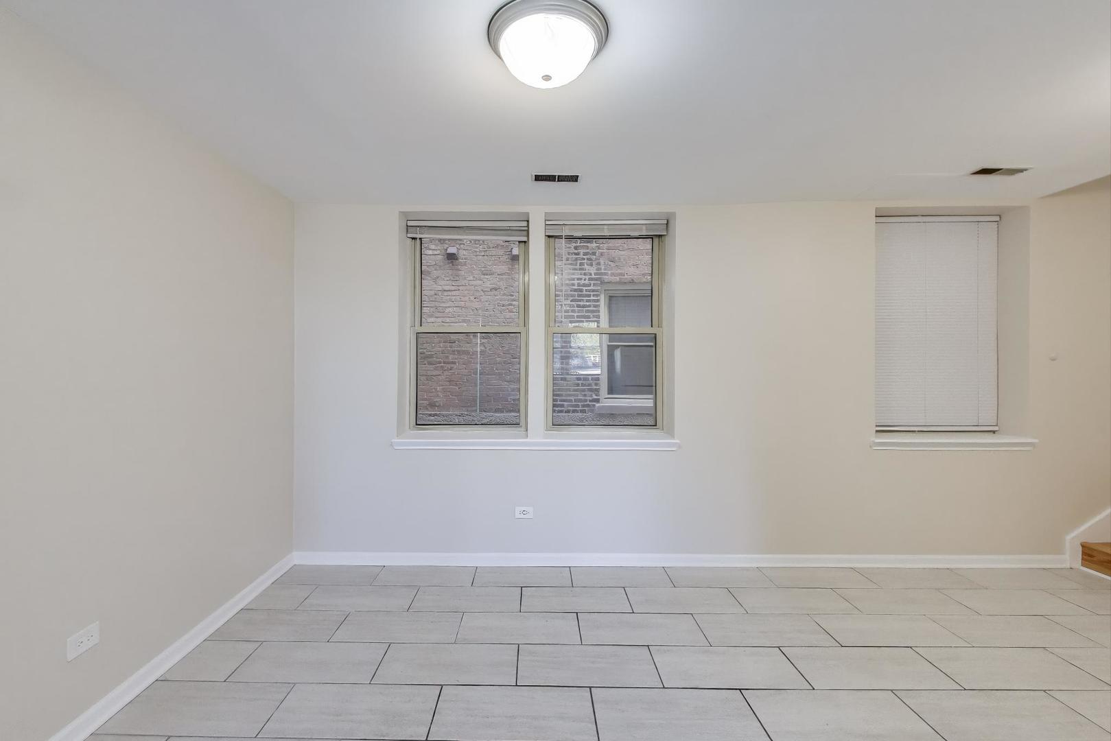 46 6th Avenue, Unit GJ La Grange, IL 60525 - Photo 6 of 15 an empty room with windows