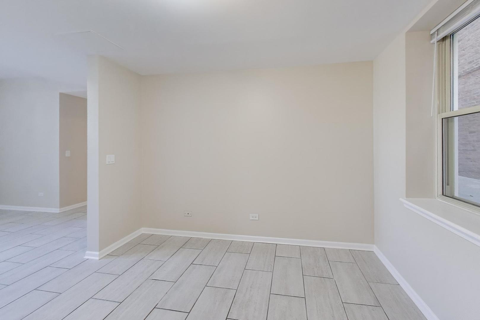 46 6th Avenue, Unit GJ La Grange, IL 60525 - Photo 7 of 15 an empty room with windows