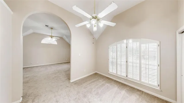 a bathroom with a bathtub sink and mirror