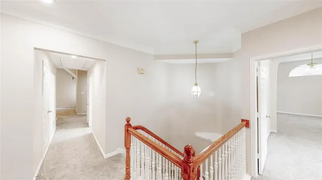 a view of a house with swimming pool and sitting area
