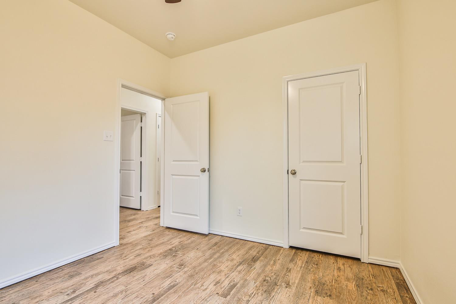 2004 23rd Street Lubbock, TX 79411 - Photo 20 of 26 a view of an empty room and wooden floor