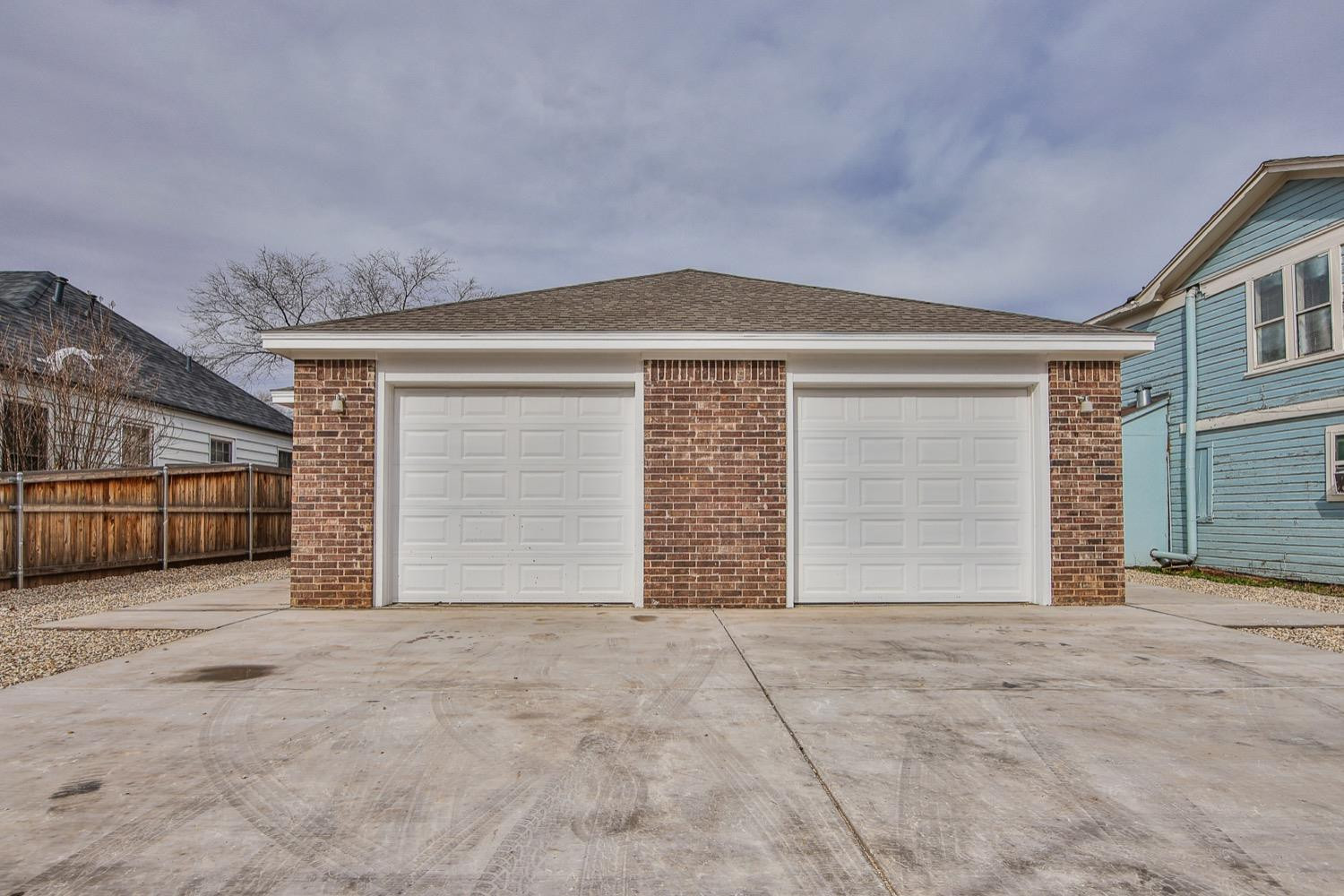 2004 23rd Street Lubbock, TX 79411 - Photo 2 of 26 a front view of a house with a garage
