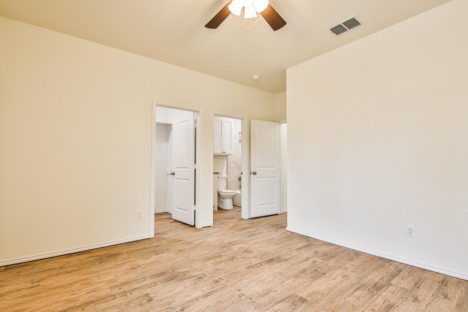 2004 23rd Street Lubbock, TX 79411 - Photo 23 of 26 a view of an empty room with wooden floor