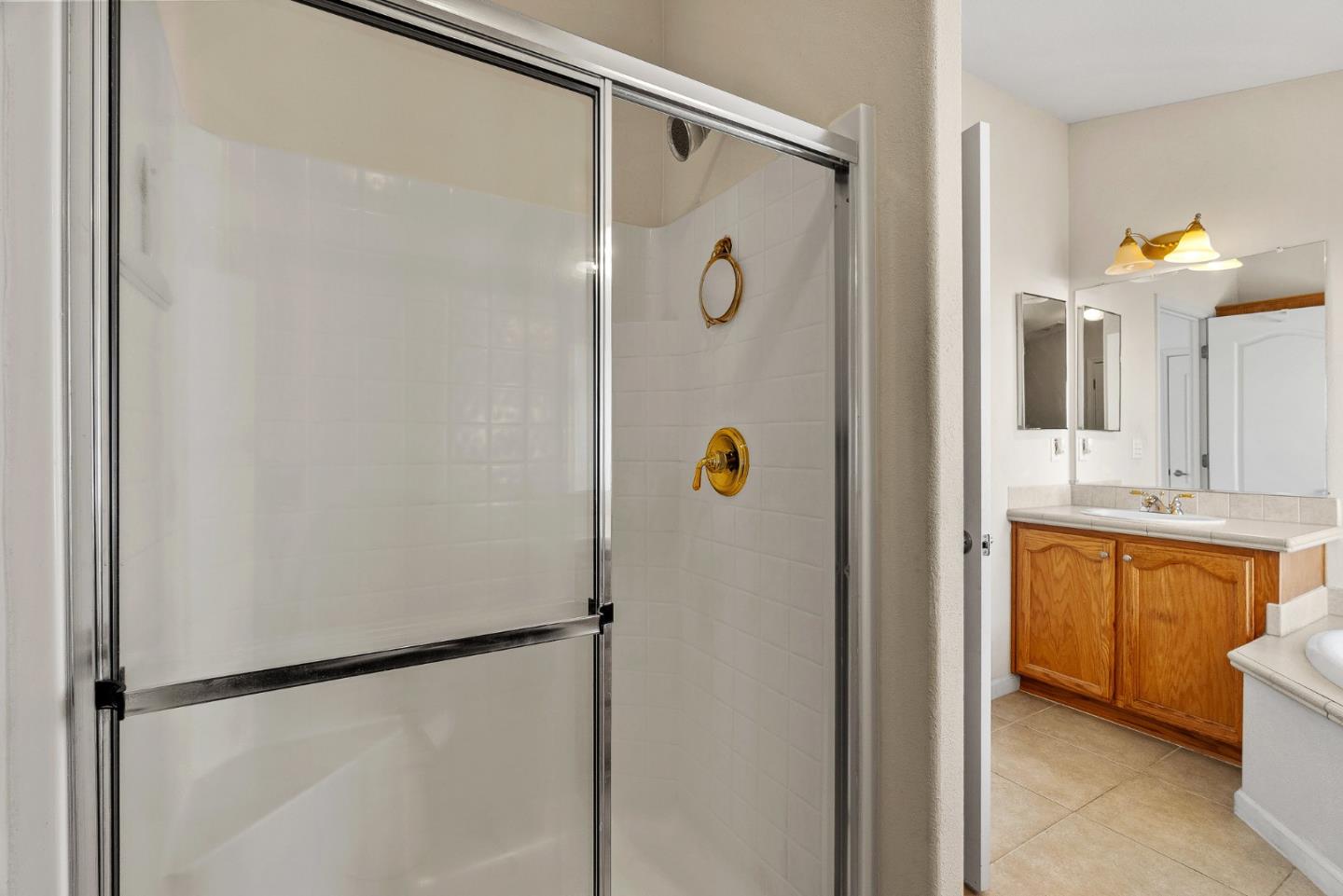4160 Jade Street, Unit 72 Capitola, CA 95010 - Photo 15 of 23 a bathroom with a shower and a mirror