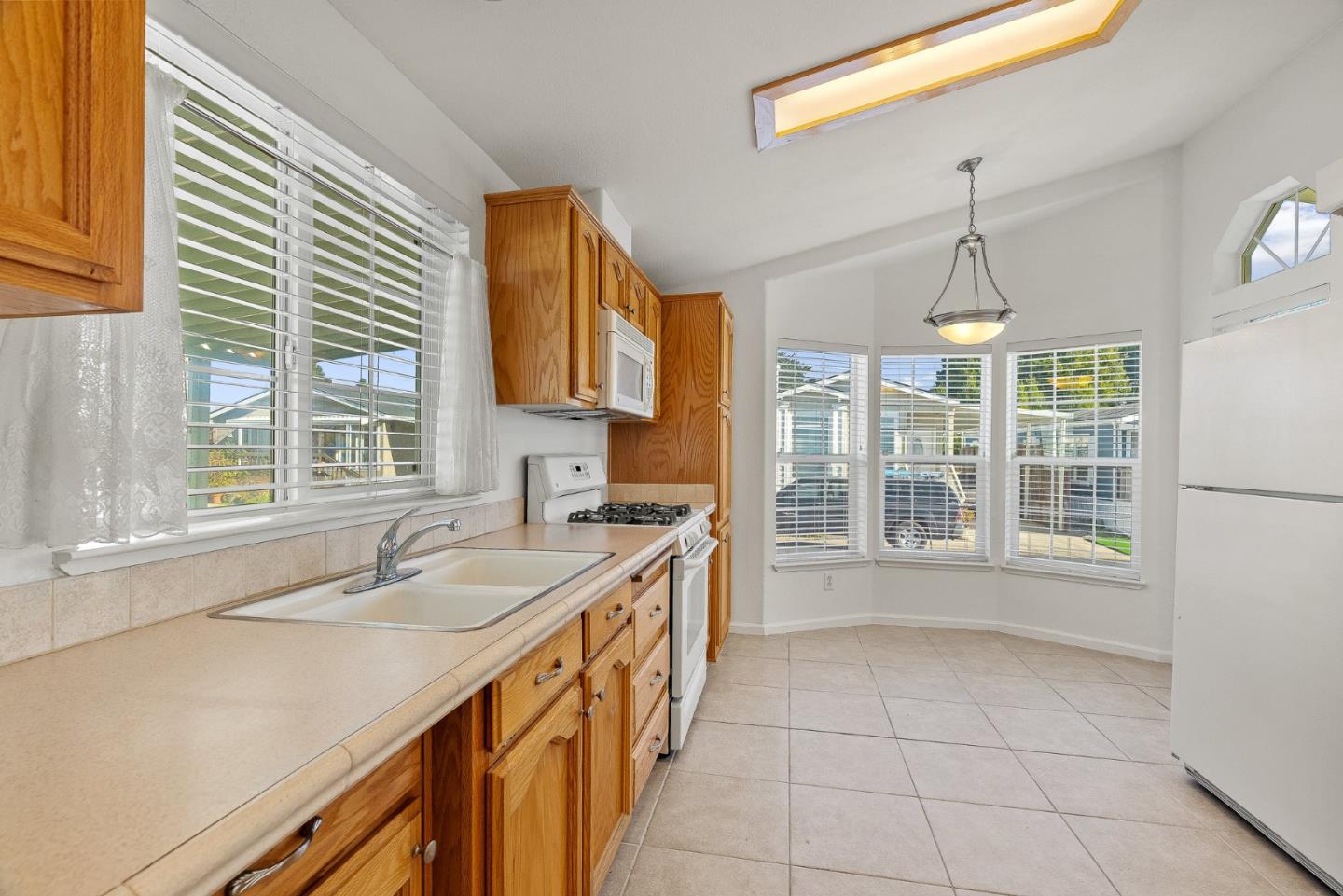 4160 Jade Street, Unit 72 Capitola, CA 95010 - Photo 6 of 23 a kitchen with a sink and a window