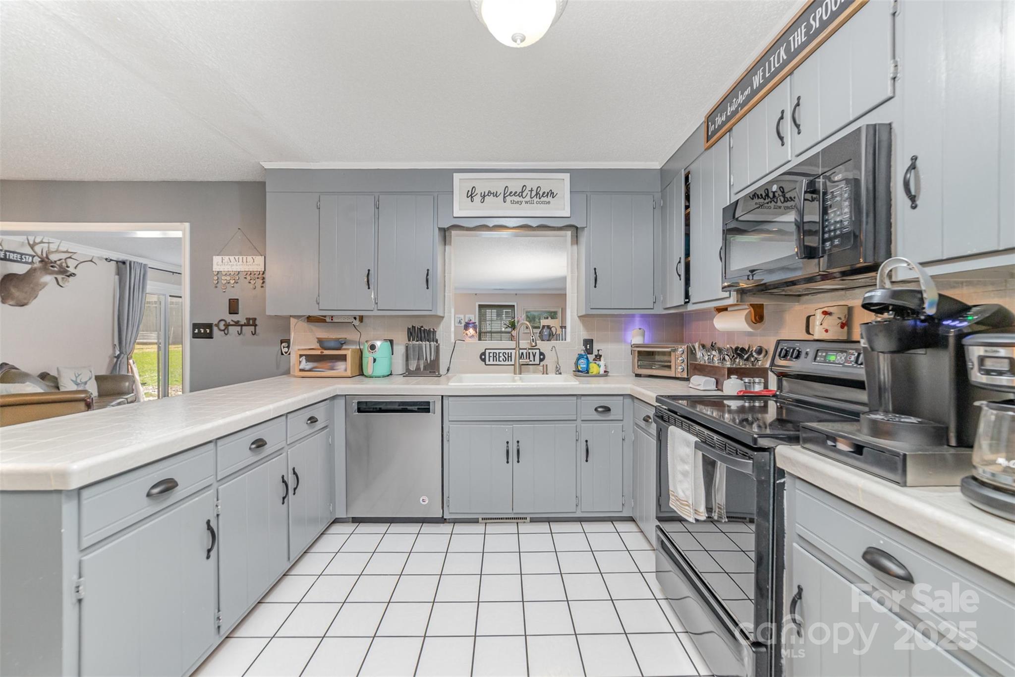 7430 Forney Hill Road Denver, NC 28037 - Photo 12 of 29 a kitchen with cabinets appliances and a sink