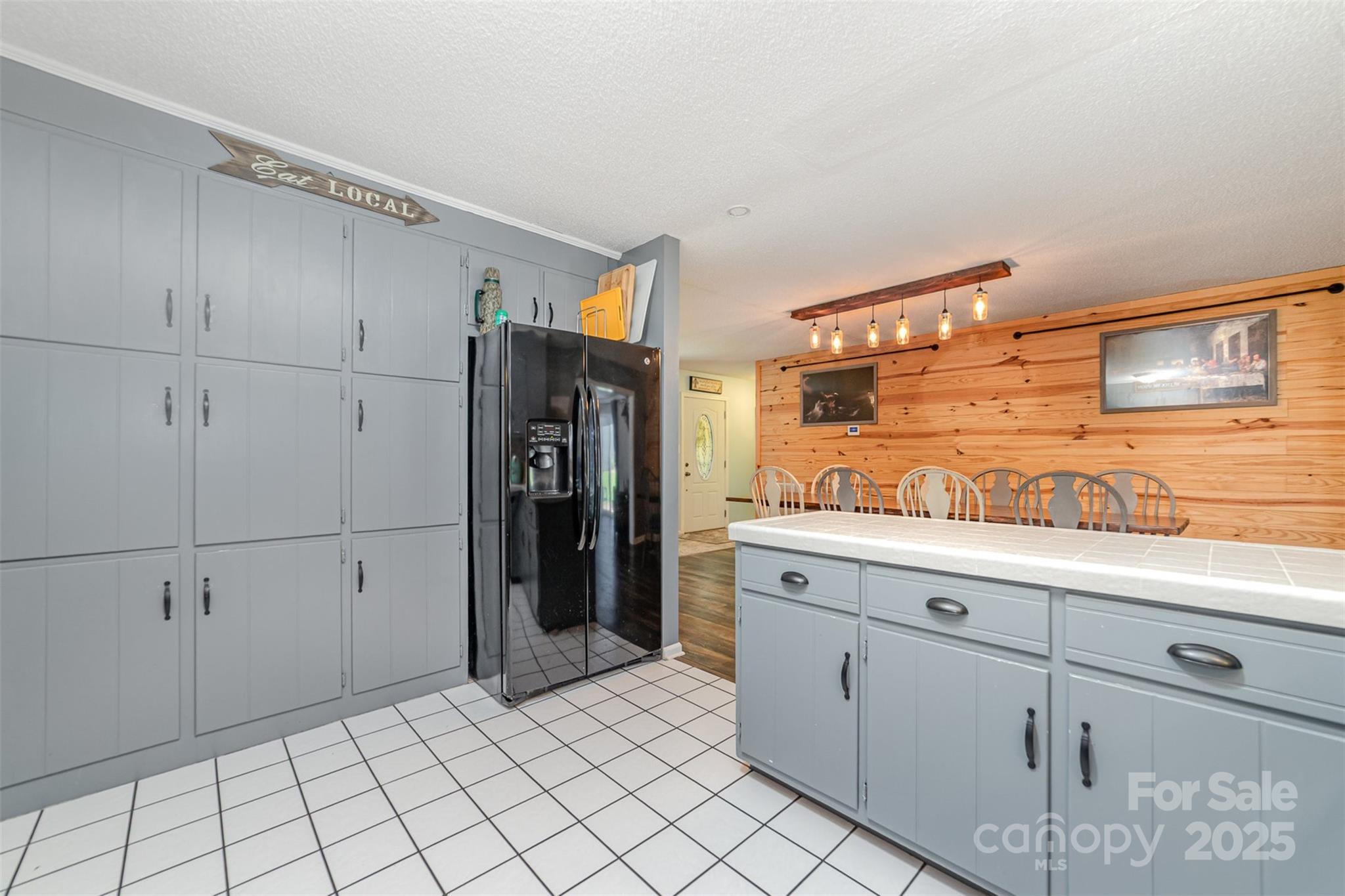 7430 Forney Hill Road Denver, NC 28037 - Photo 13 of 29 a kitchen with white cabinets and refrigerator