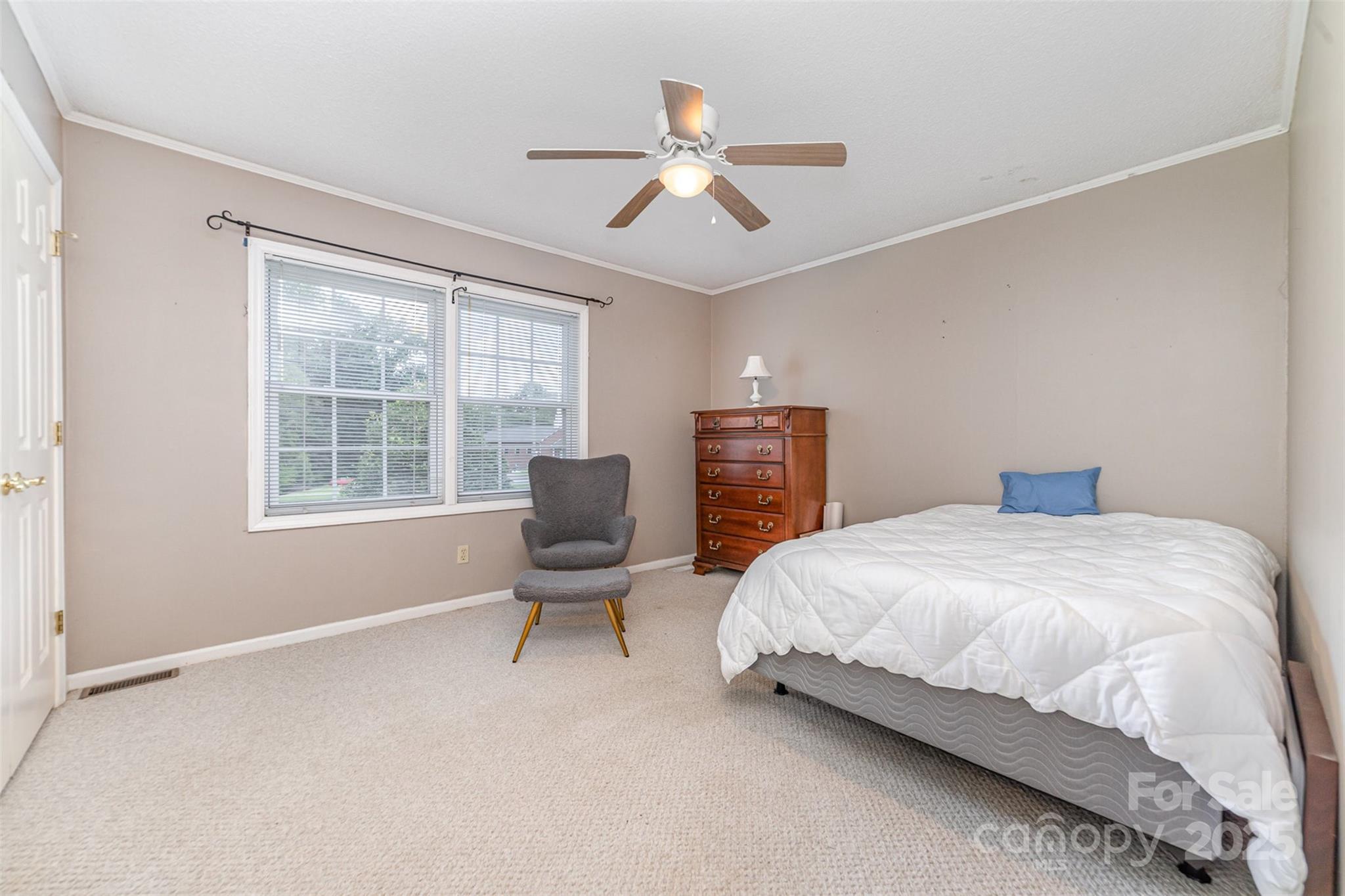 7430 Forney Hill Road Denver, NC 28037 - Photo 20 of 29 a bedroom with a bed and a window