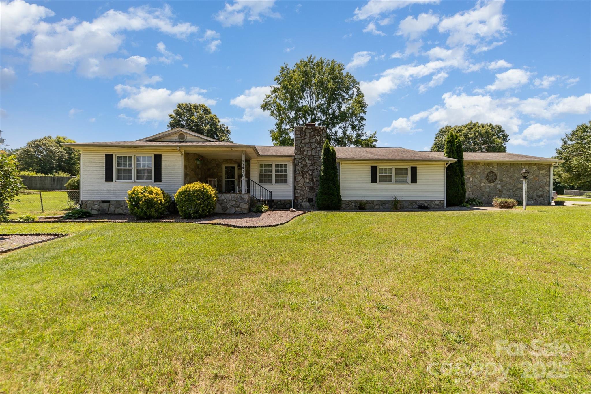 7430 Forney Hill Road Denver, NC 28037 - Photo 2 of 29 a view of a house with backyard and garden