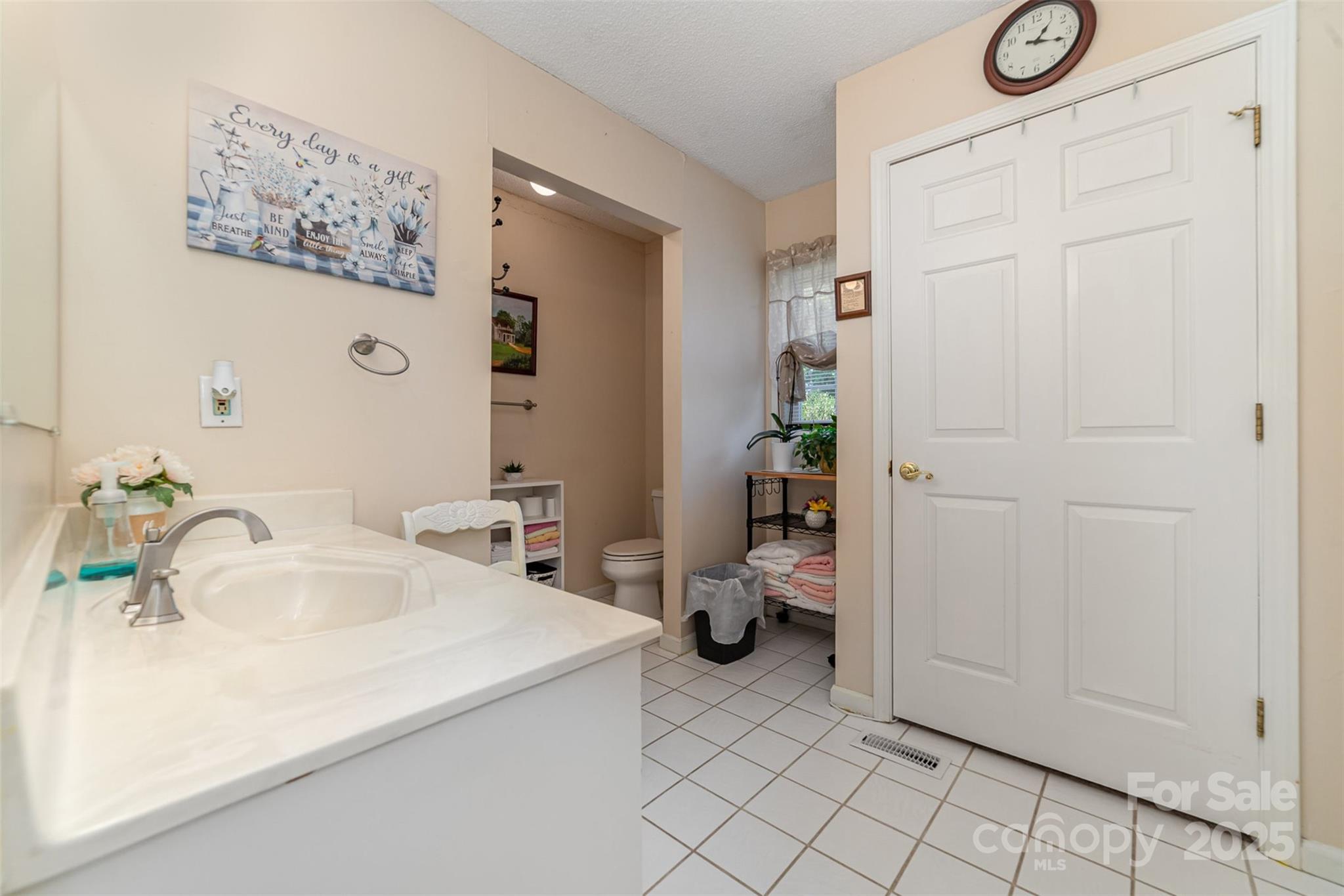 7430 Forney Hill Road Denver, NC 28037 - Photo 23 of 29 a bathroom with a sink and a mirror
