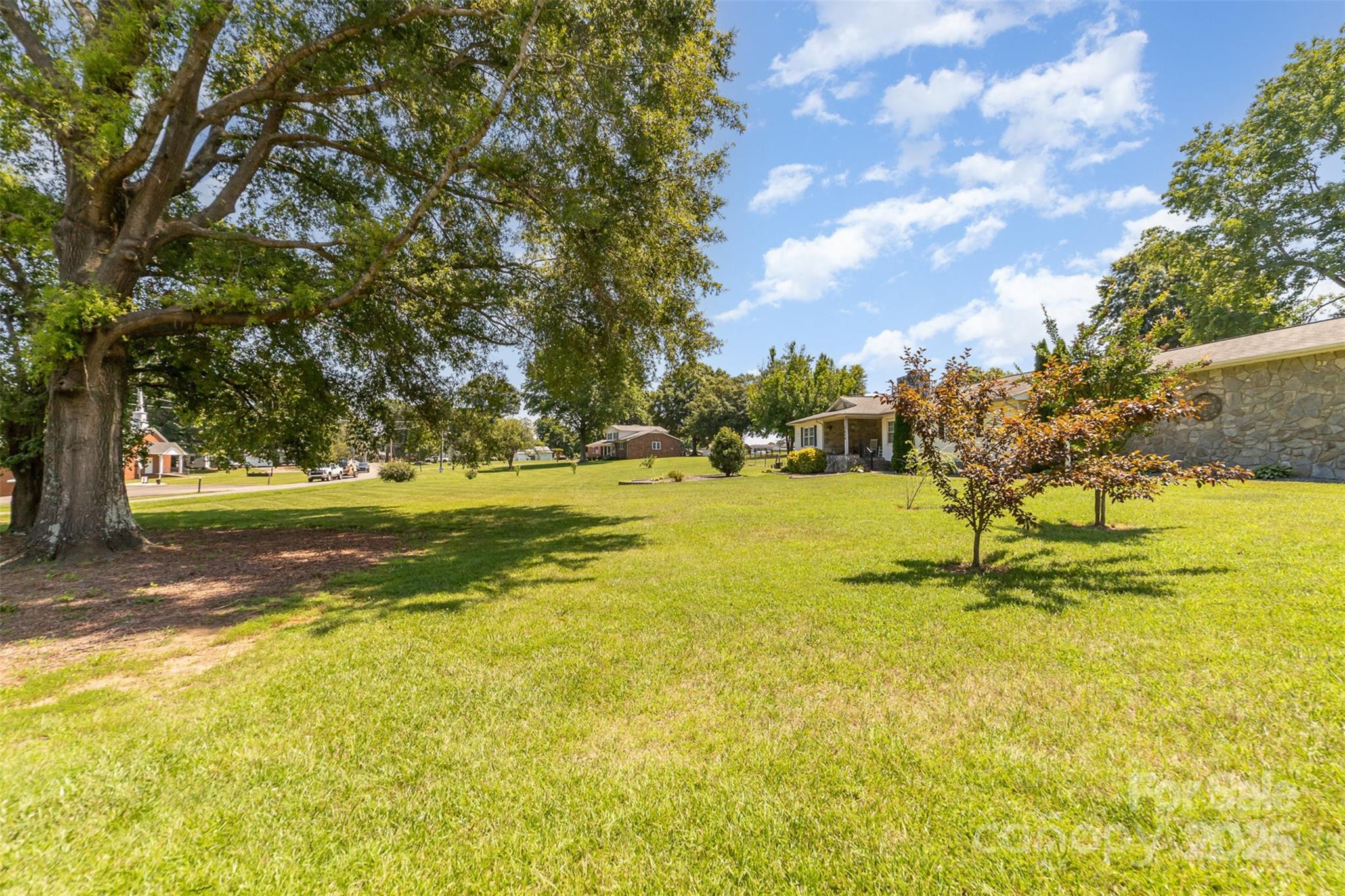 7430 Forney Hill Road Denver, NC 28037 - Photo 3 of 29 a view of yard with swimming pool and trees
