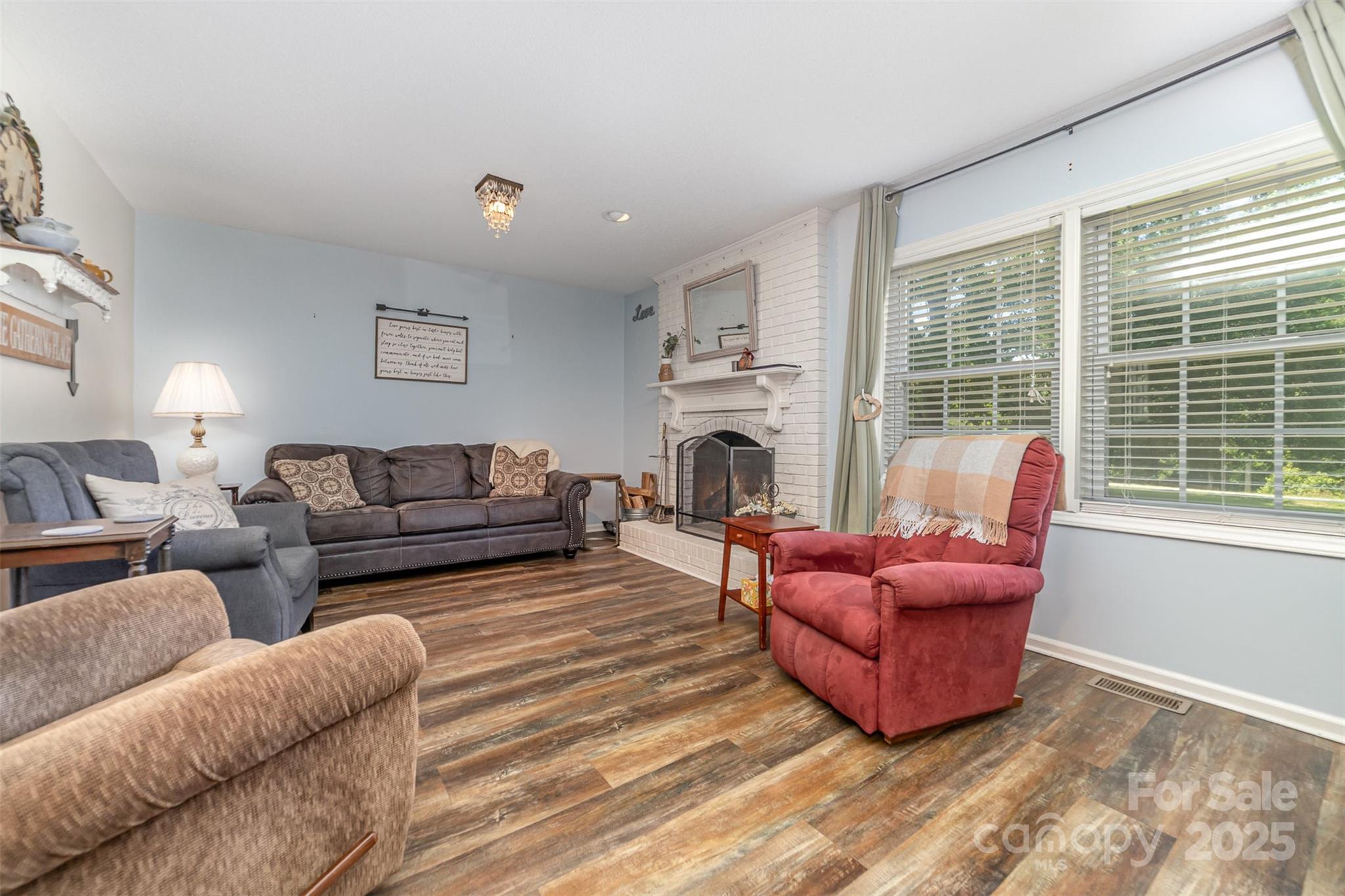 7430 Forney Hill Road Denver, NC 28037 - Photo 7 of 29 a living room with furniture or couch and a fireplace