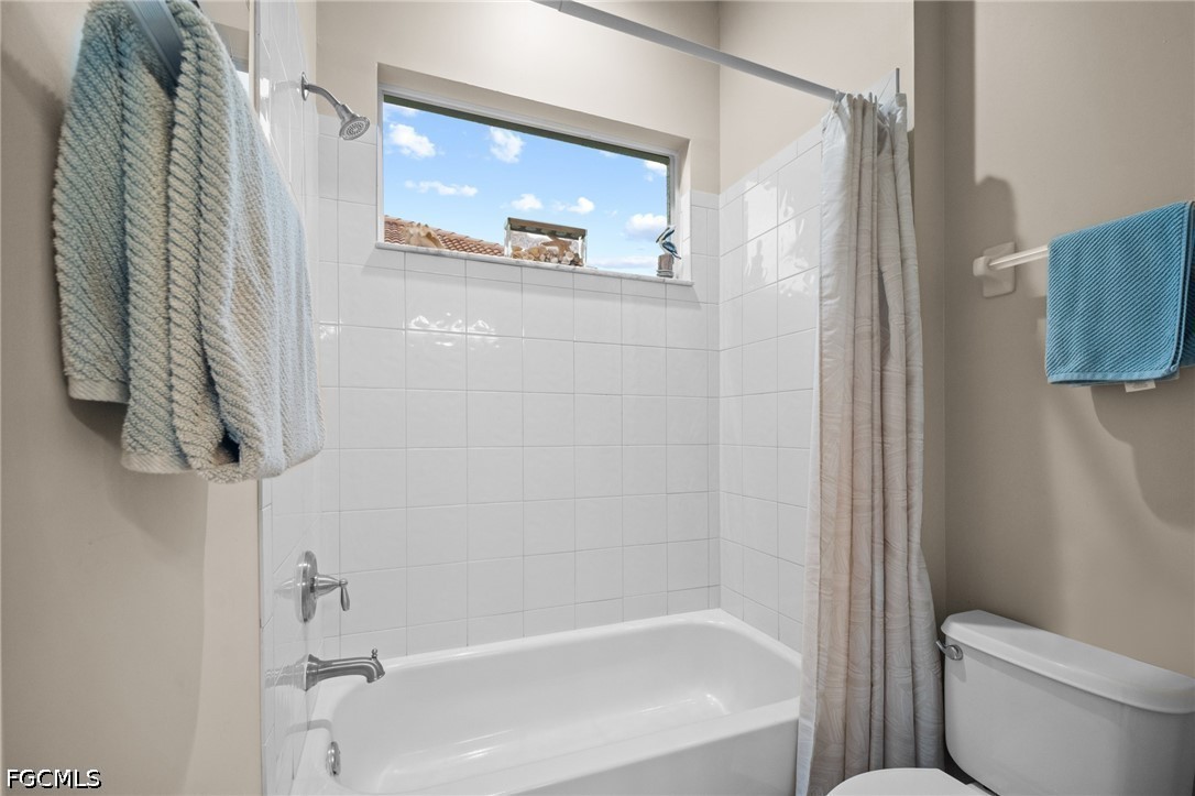 9042 Bronco Court Naples, FL 34113 - Photo 24 of 50 a bath room with a toilet and a shower