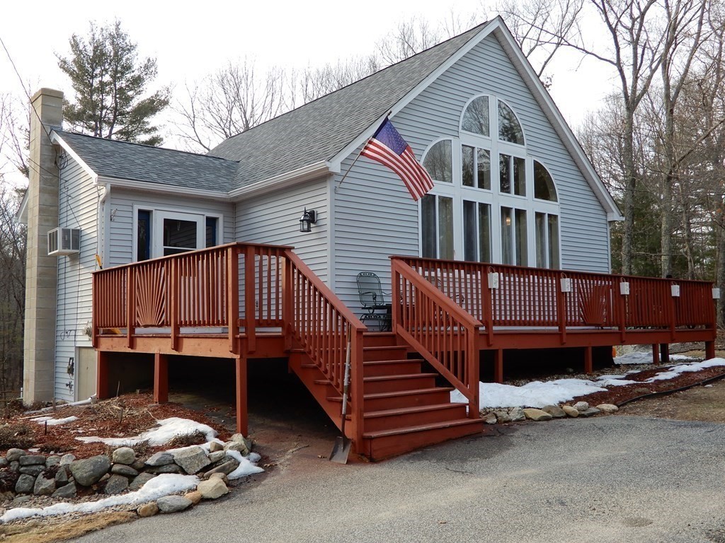 a view of backyard with deck