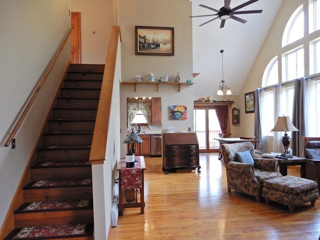 1013 Town Farm Road Warren, MA 01083 - Photo 19 of 38 a living room with furniture or stairs and a wooden floor
