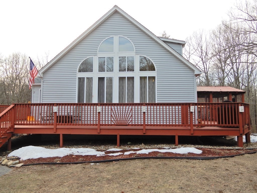1013 Town Farm Road Warren, MA 01083 - Photo 2 of 38 a front view of a house with a yard