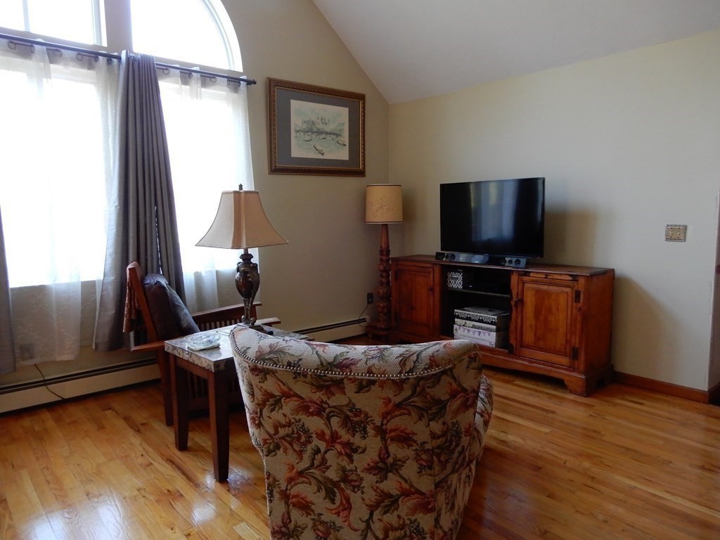 1013 Town Farm Road Warren, MA 01083 - Photo 22 of 38 a living room with furniture and a flat screen tv