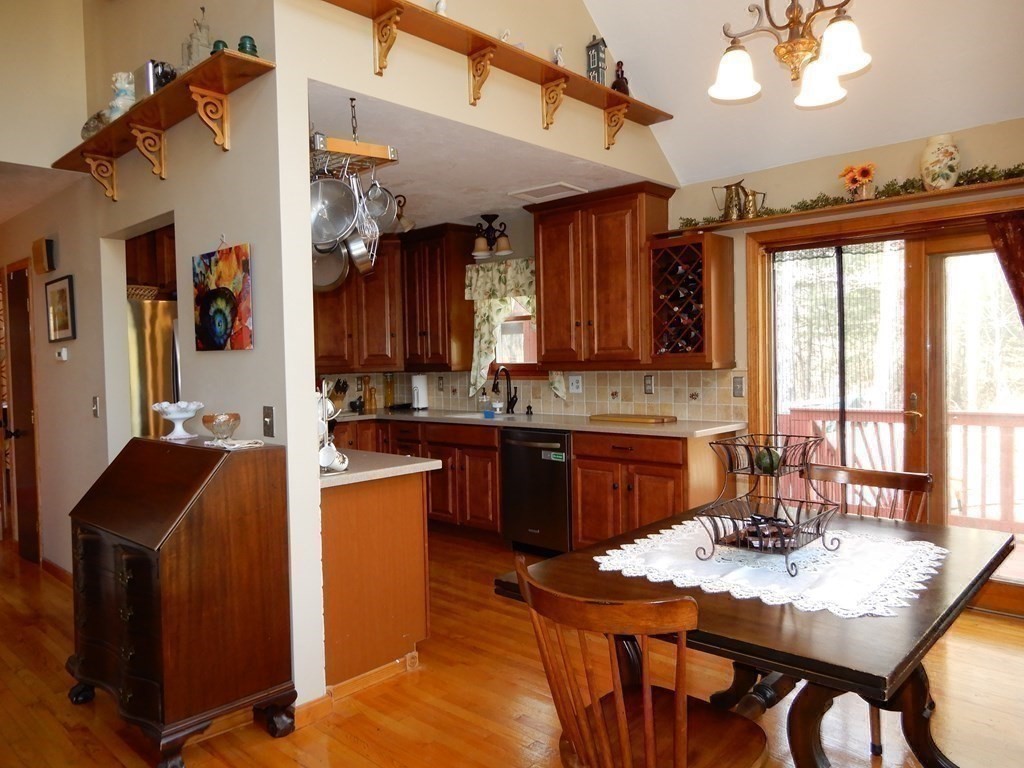 1013 Town Farm Road Warren, MA 01083 - Photo 23 of 38 a kitchen with granite countertop cabinets stainless steel appliances and a refrigerator