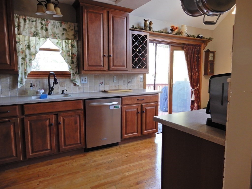 1013 Town Farm Road Warren, MA 01083 - Photo 26 of 38 a kitchen with a sink cabinets and a wooden floor