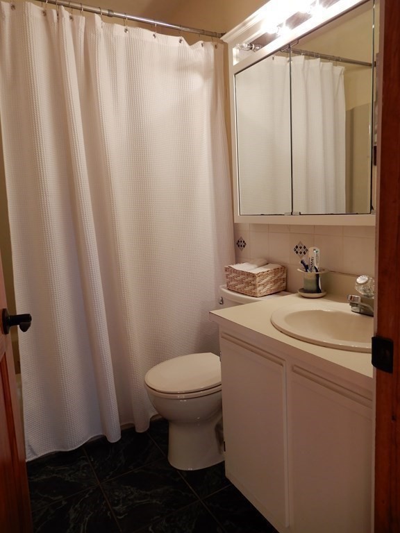 1013 Town Farm Road Warren, MA 01083 - Photo 29 of 38 a bathroom with a sink and a mirror