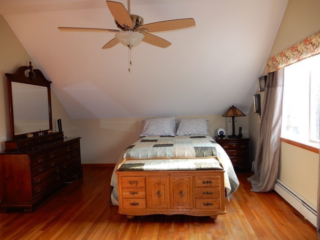 1013 Town Farm Road Warren, MA 01083 - Photo 30 of 38 a bedroom with a bed and wooden floor