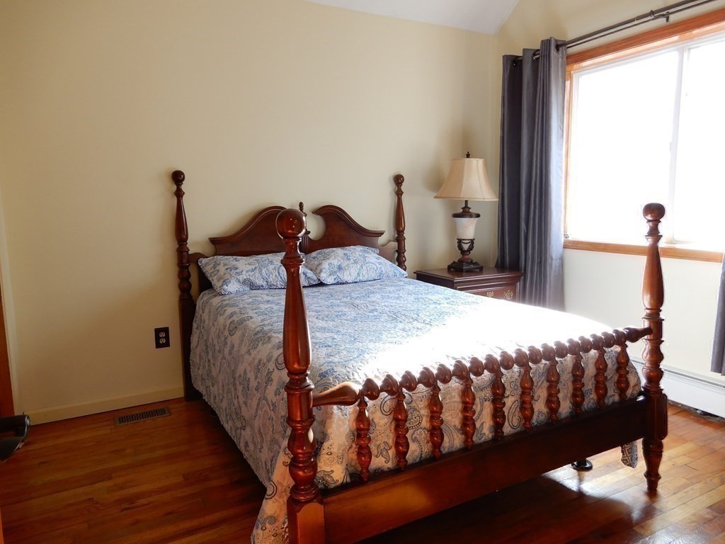 1013 Town Farm Road Warren, MA 01083 - Photo 34 of 38 a bedroom with a bed and wooden floor