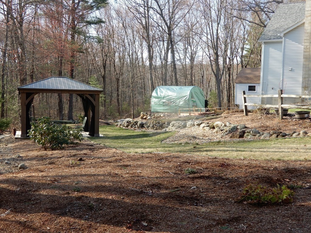 1013 Town Farm Road Warren, MA 01083 - Photo 6 of 38 a front view of a house with garden