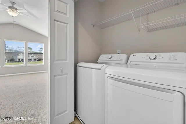 a utility room with dryer and washer