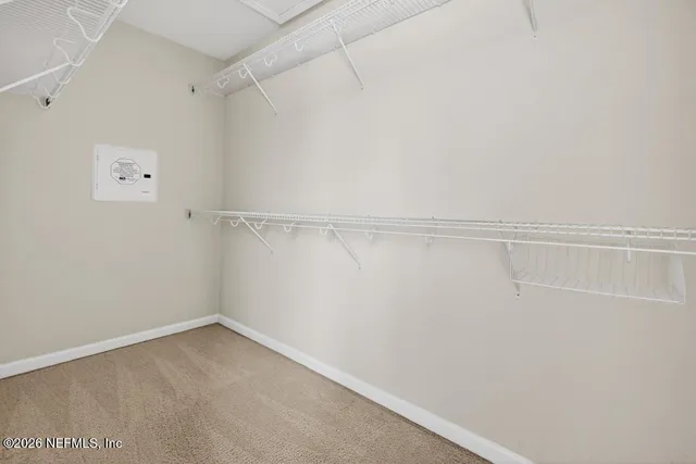 a view of an empty walk in closet