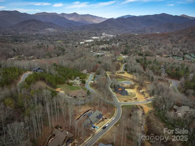 a view of a town with mountains in the background